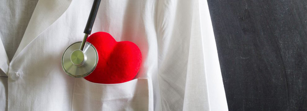 doctor with toy heart in his pocket