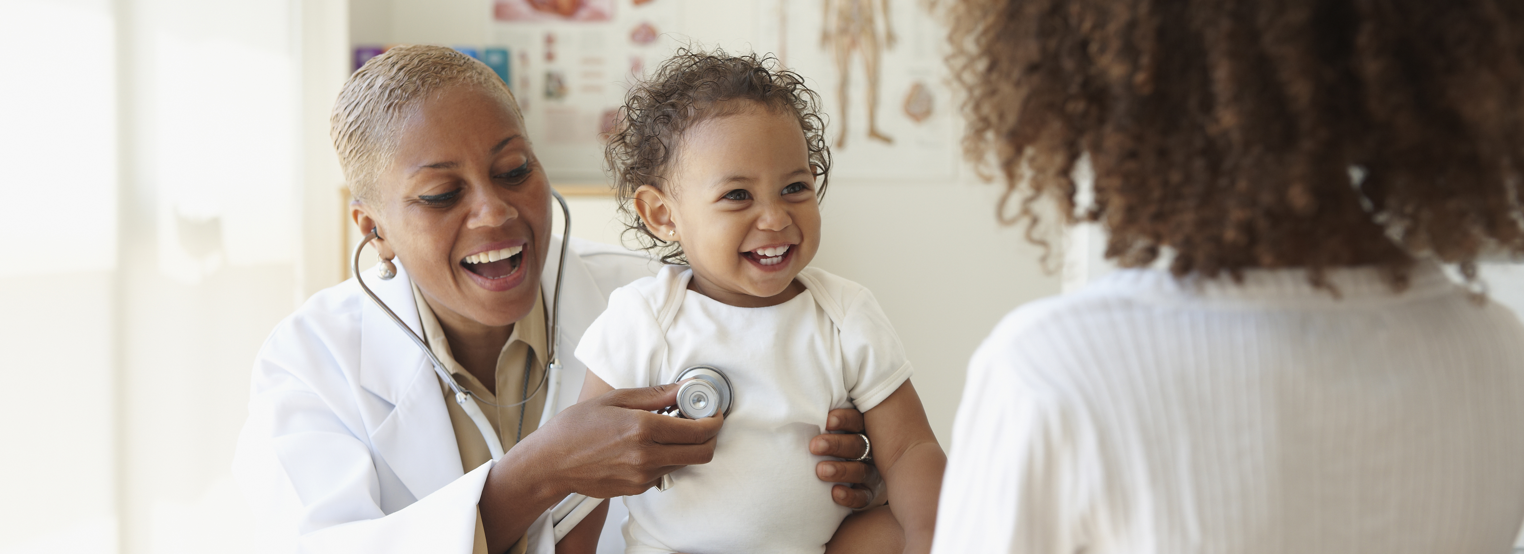 doctor examining infant