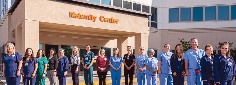 Medical Workers standing in front of building